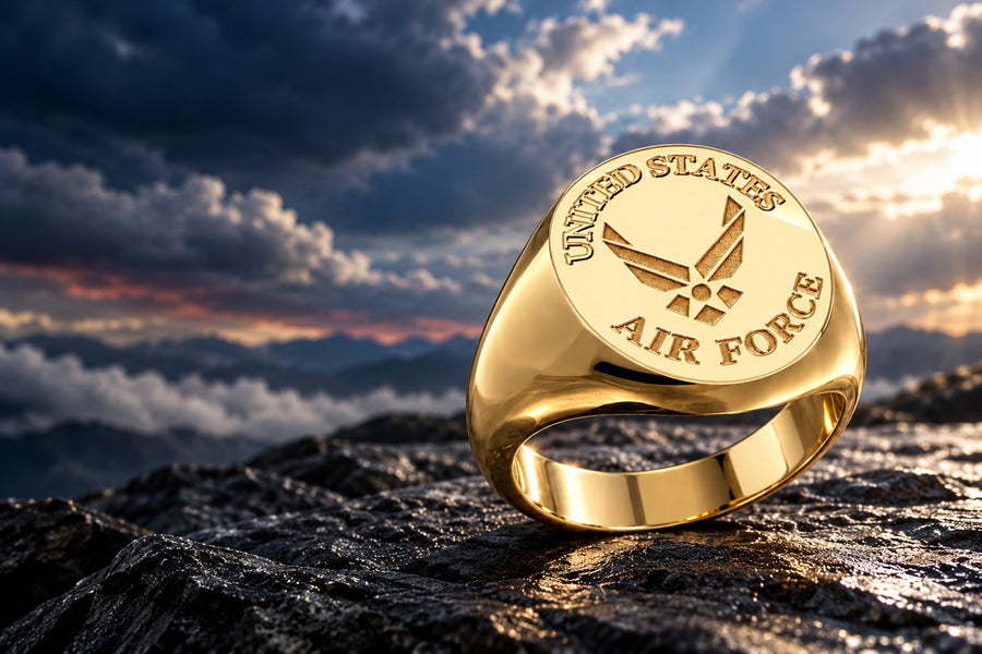 Gold U.S. Air Force signet ring with the Air Force Symbol against a dramatic sky